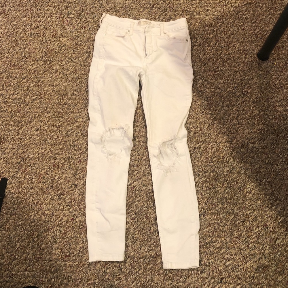 Free People white jeans with holes in the knees